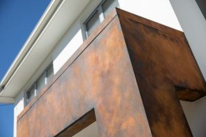 Rust effect paint used on entrance way on Morningside Residence with a burnt orange colour scheme