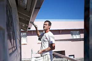 rochele painter working on an exterior house painting job